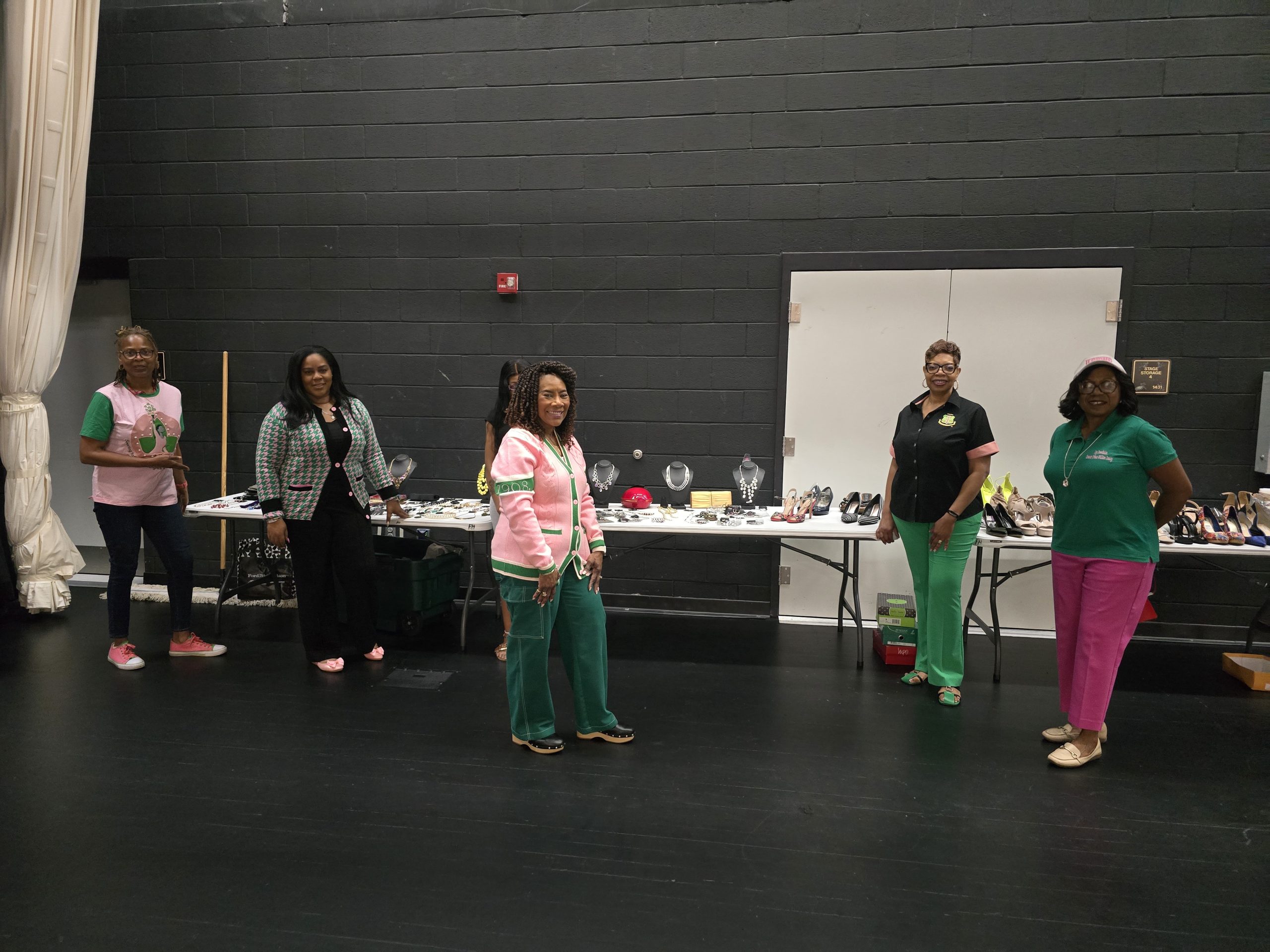 Foundation members stand in front of donated items.
